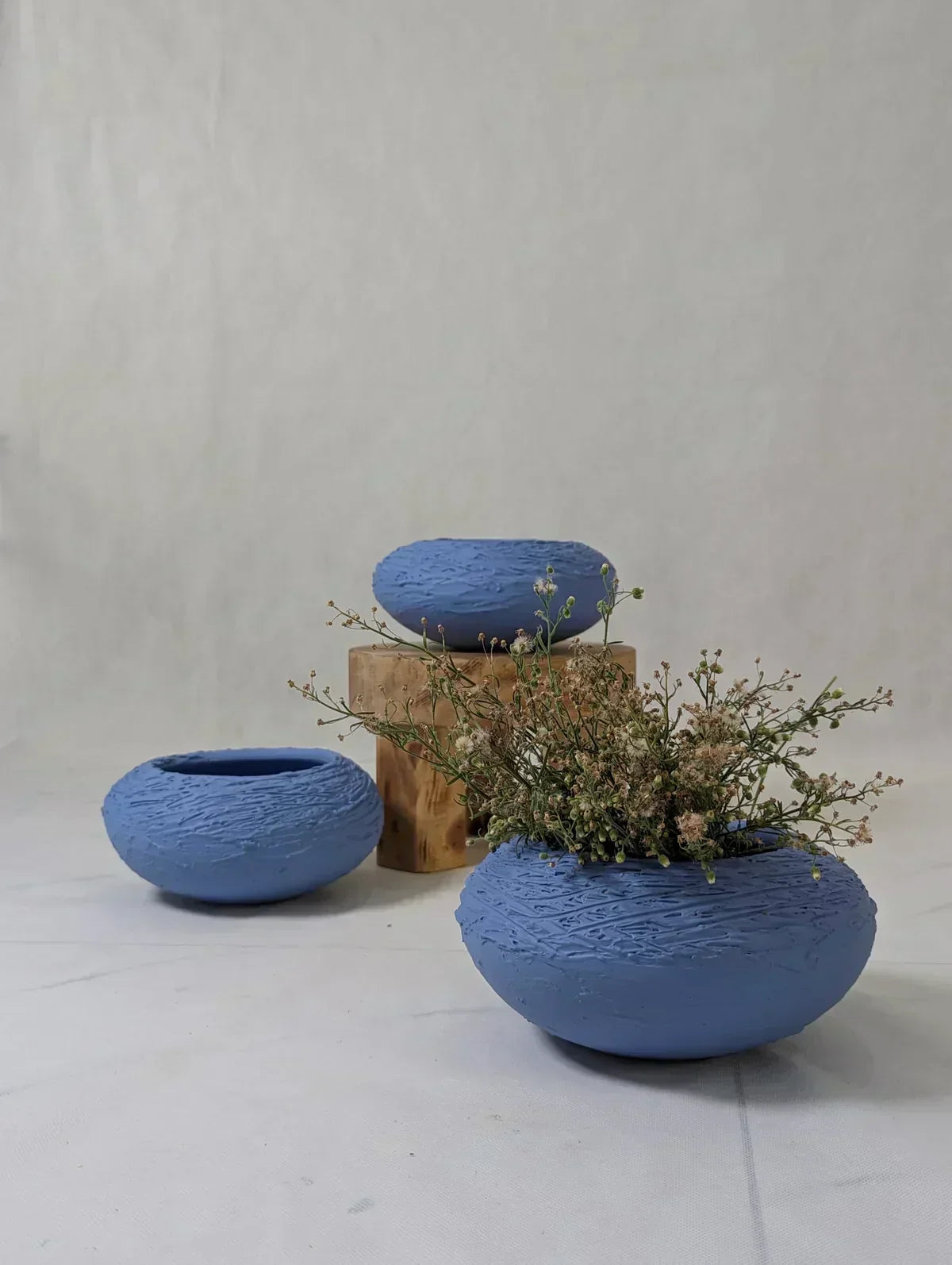 Handmade Den Soft Blue Ceramic Vase, 4" tall, 9" wide, nest-like design for home decor
