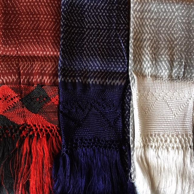Three scarves with different patterns and colors displayed side by side Cobalt White