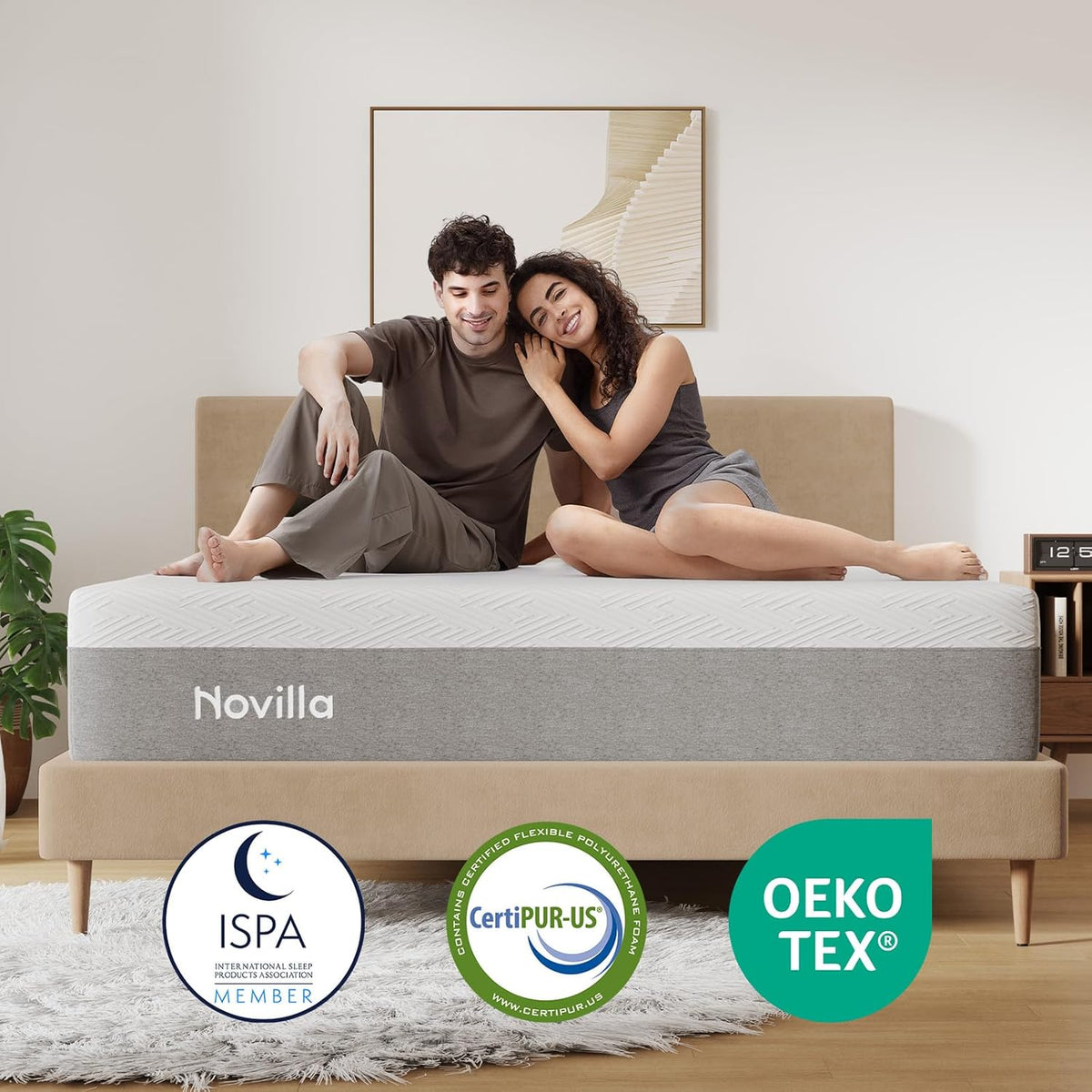 Novilla mattress on a bed with green pillows and a beige blanket in a bedroom setting gray