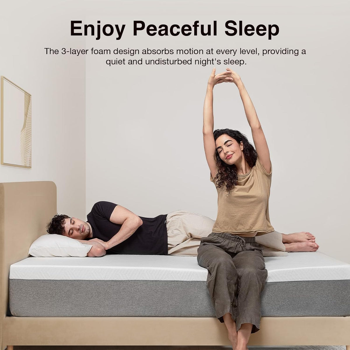 Novilla mattress on a bed with green pillows and a beige blanket in a bedroom setting gray
