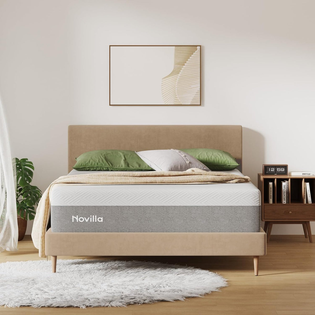 Novilla mattress on a bed with green pillows and a beige blanket in a bedroom setting gray