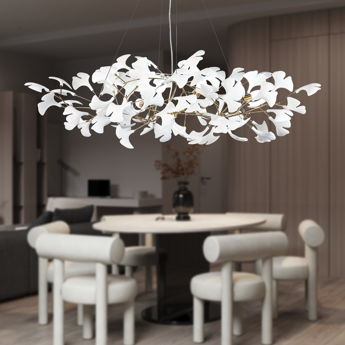 Modern chandelier hanging above a dining table in a stylish room.