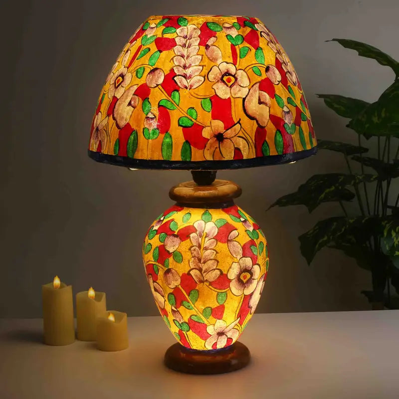 “Yellow floral camel skin lamp – handpainted artisan lamp with wooden base and warm glow”