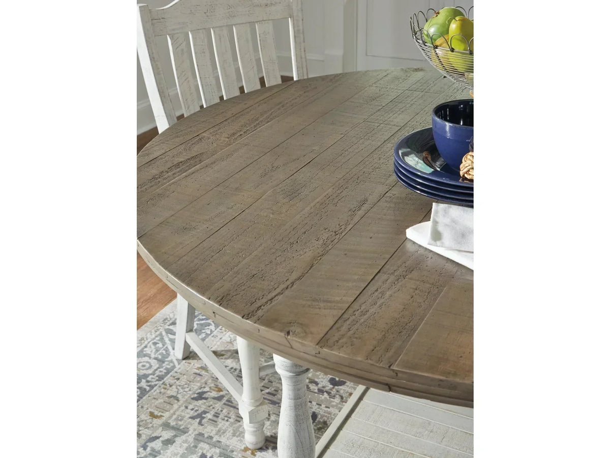 Wooden dining table with chairs in a room setting