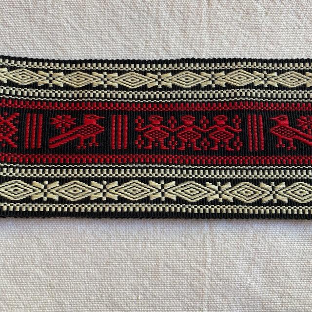 Decorative belt with red, black, and beige patterns on a light background Authentic large woven faja from Cuanajo, Michoacán. Handwoven on a backstrap loom with traditional Purepecha designs. Cotton sash, 54" x 3.5" – wearable or decorative.