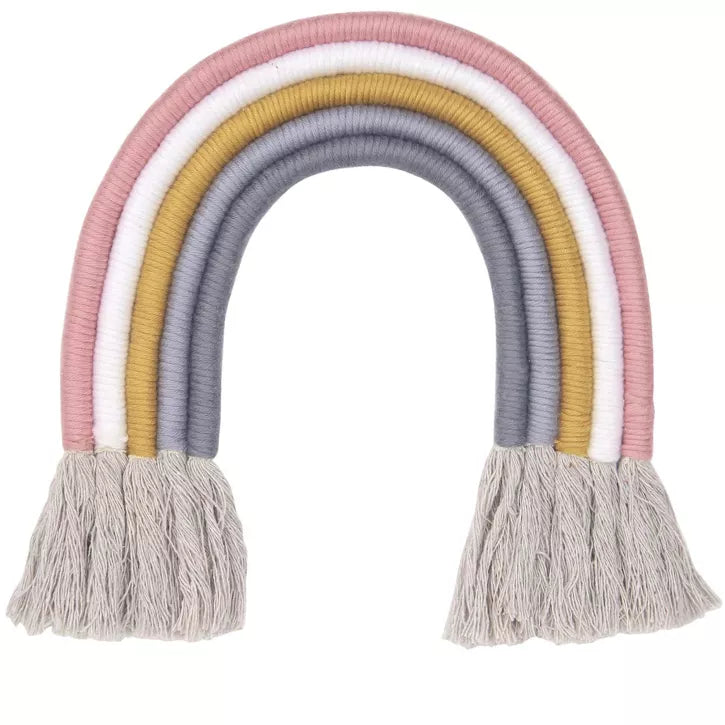 Decorative rainbow arch with pastel colors and tassels on a white background