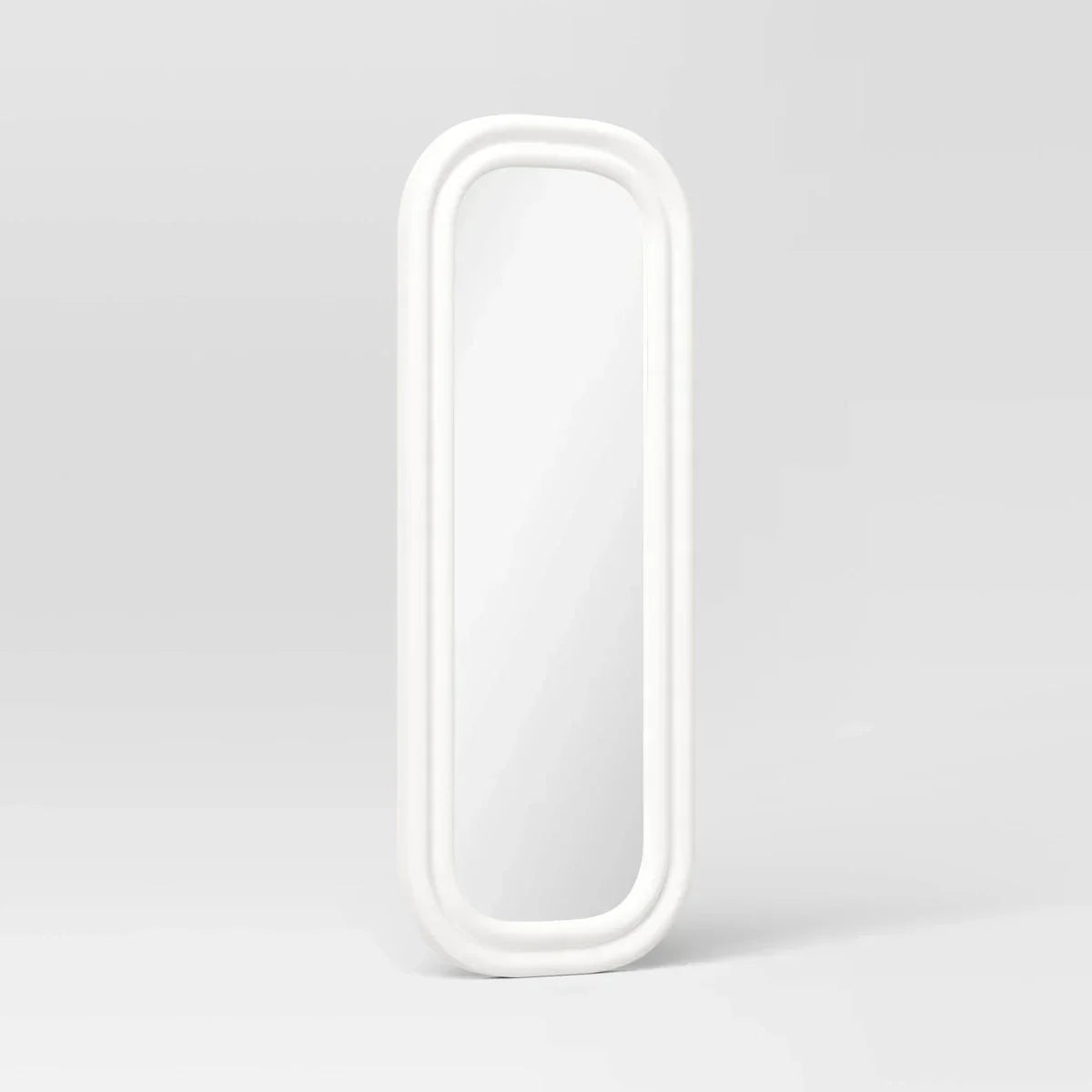A white colored mirror with a rounded rectangular frame against a light gray background.