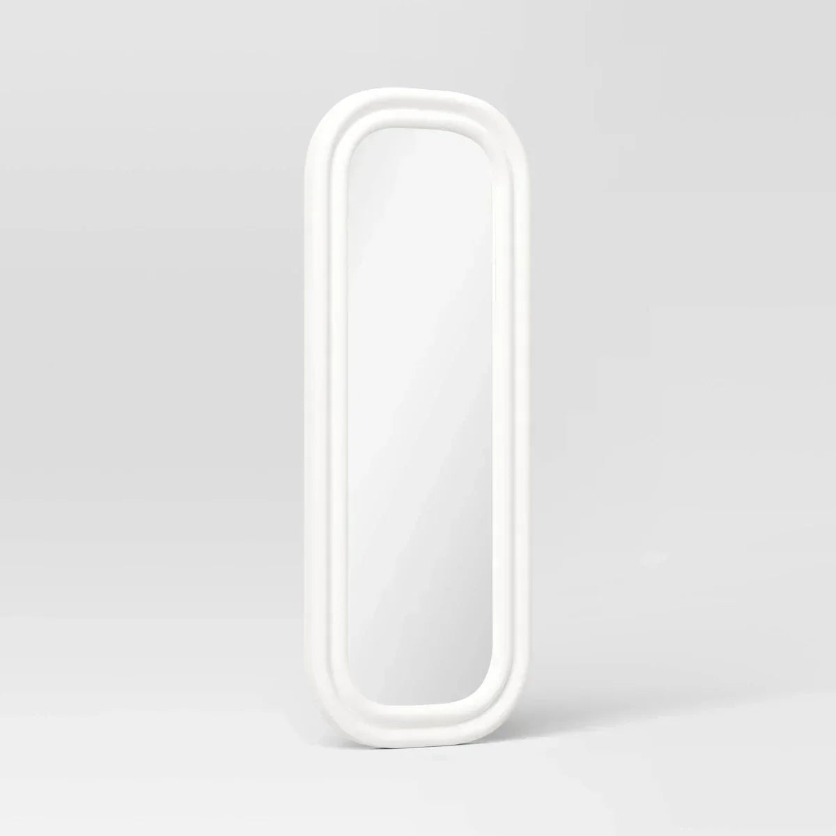 A white colored mirror with a rounded rectangular frame against a light gray background.