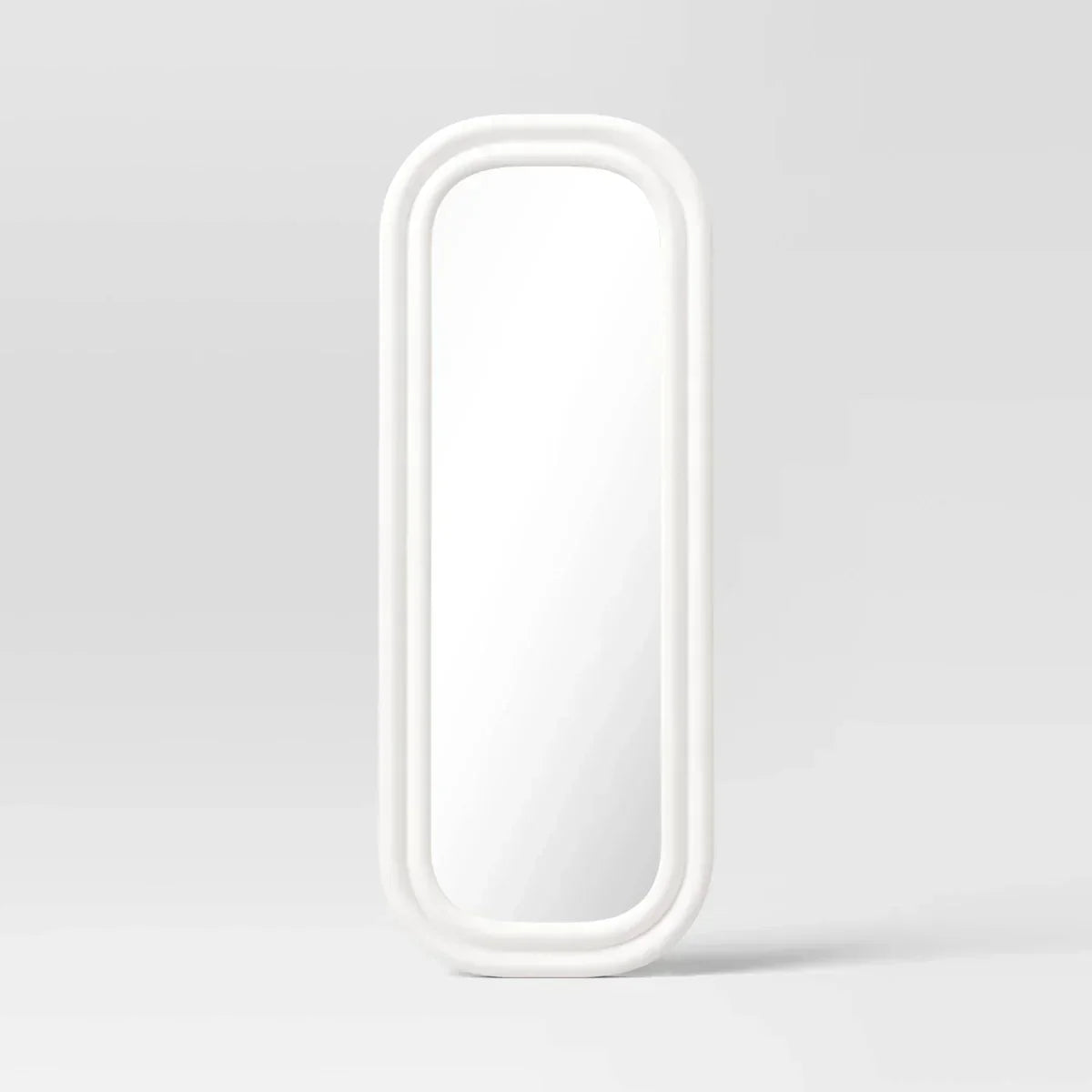A white colored mirror with a rounded rectangular frame against a light gray background.