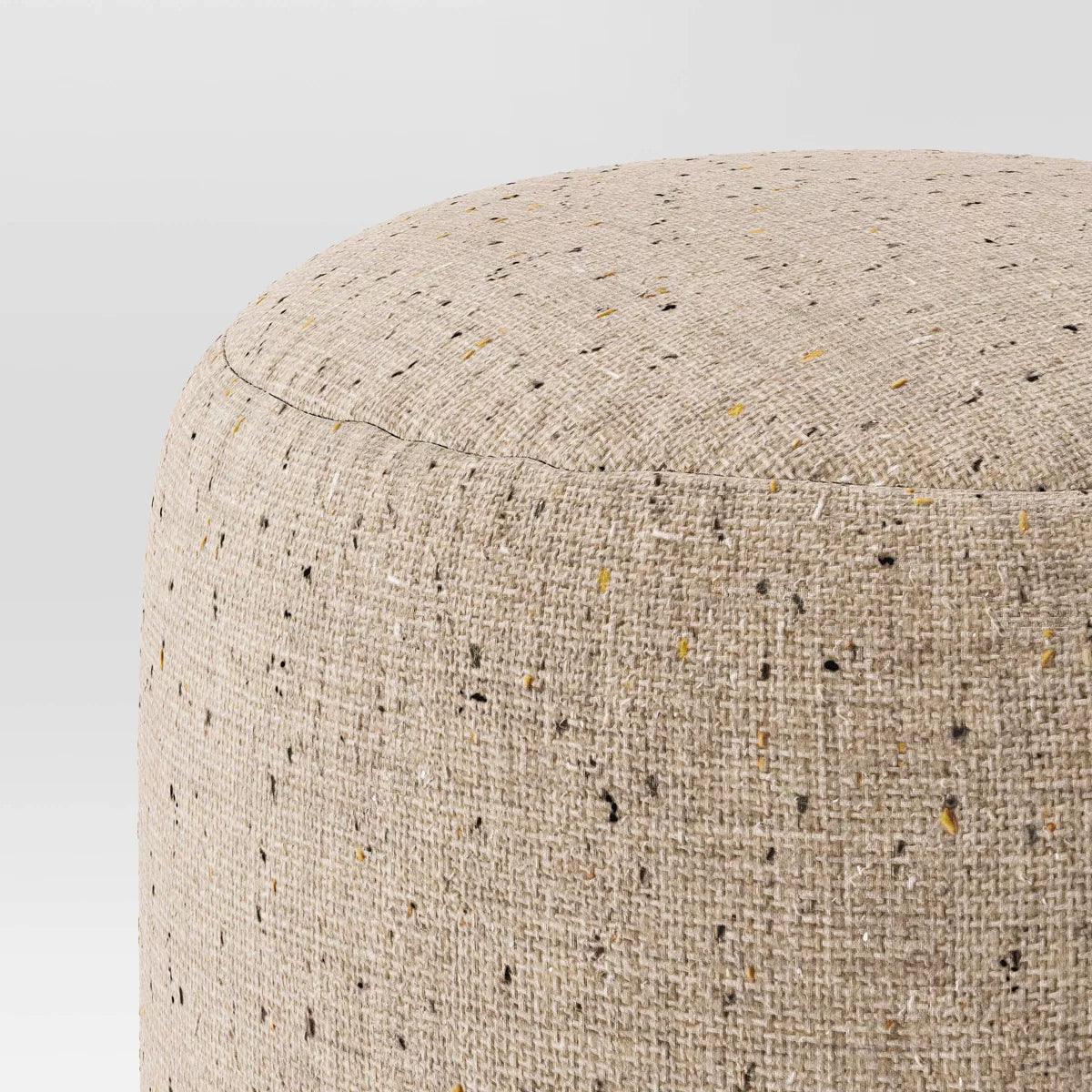 A cylindrical ottoman with dimensions of 16 inches in height and 16 inches in diameter.