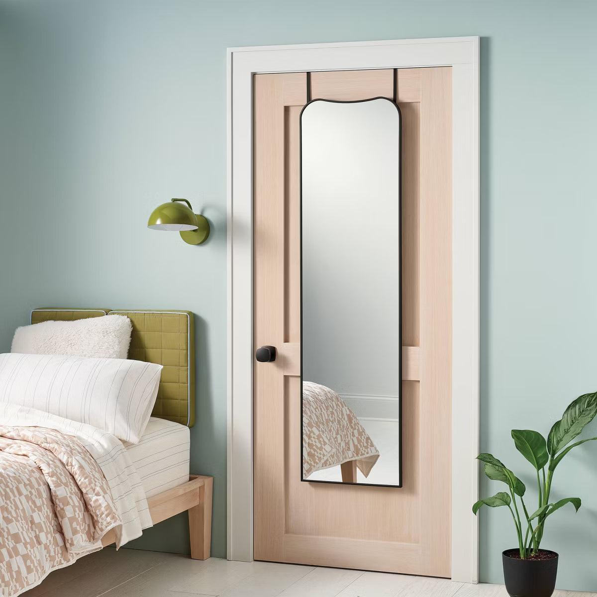 Rectangular mirror with a black colored frame.