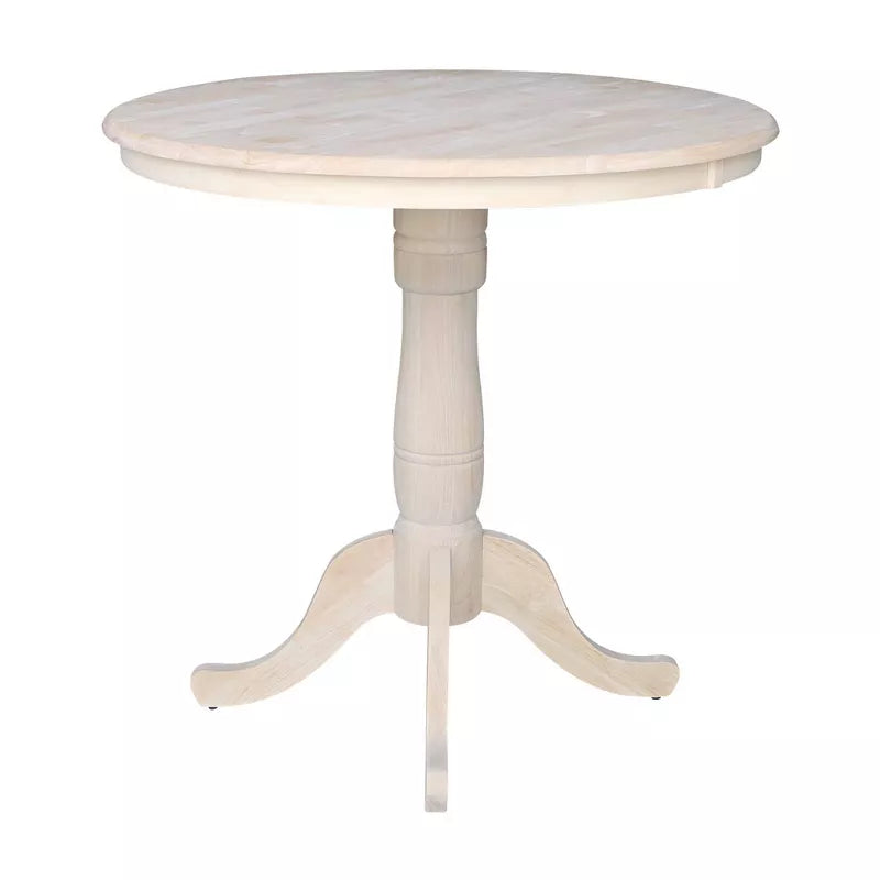 Round white table with a pedestal base on a white background