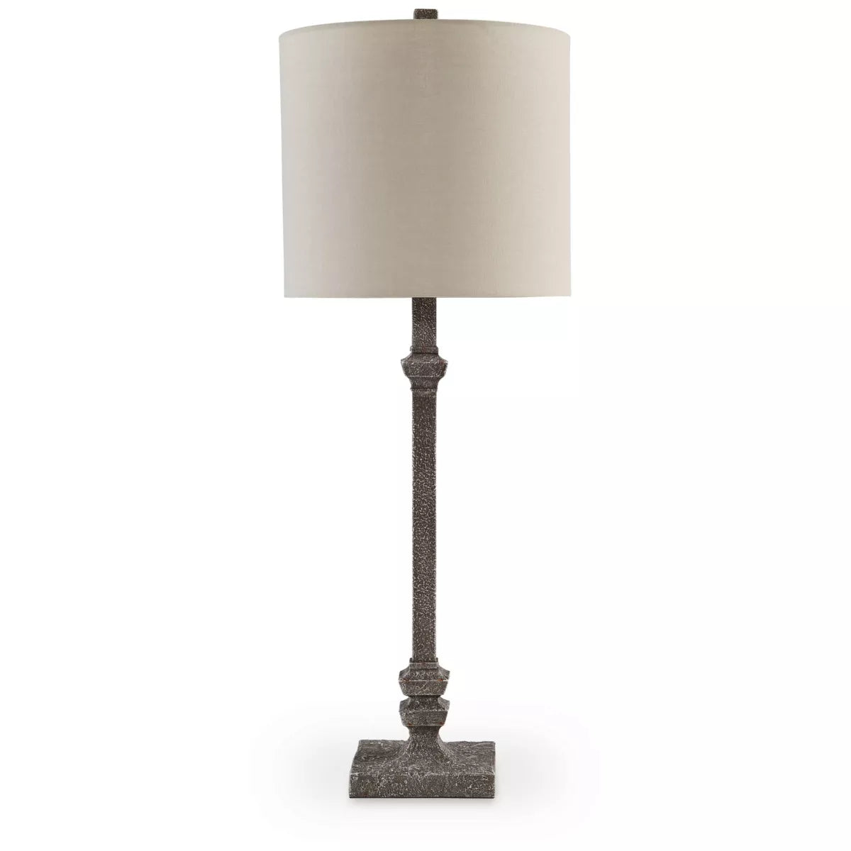 Table lamp with a textured base and beige shade on a white background