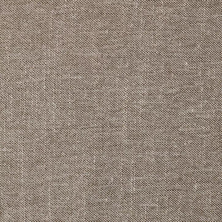 Hexagonal light gray colored ottoman with dark trim placed on a patterned rug in a living room setting.