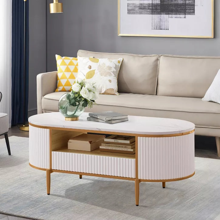 Living room with a beige sofa, coffee table, and decorative pillows.