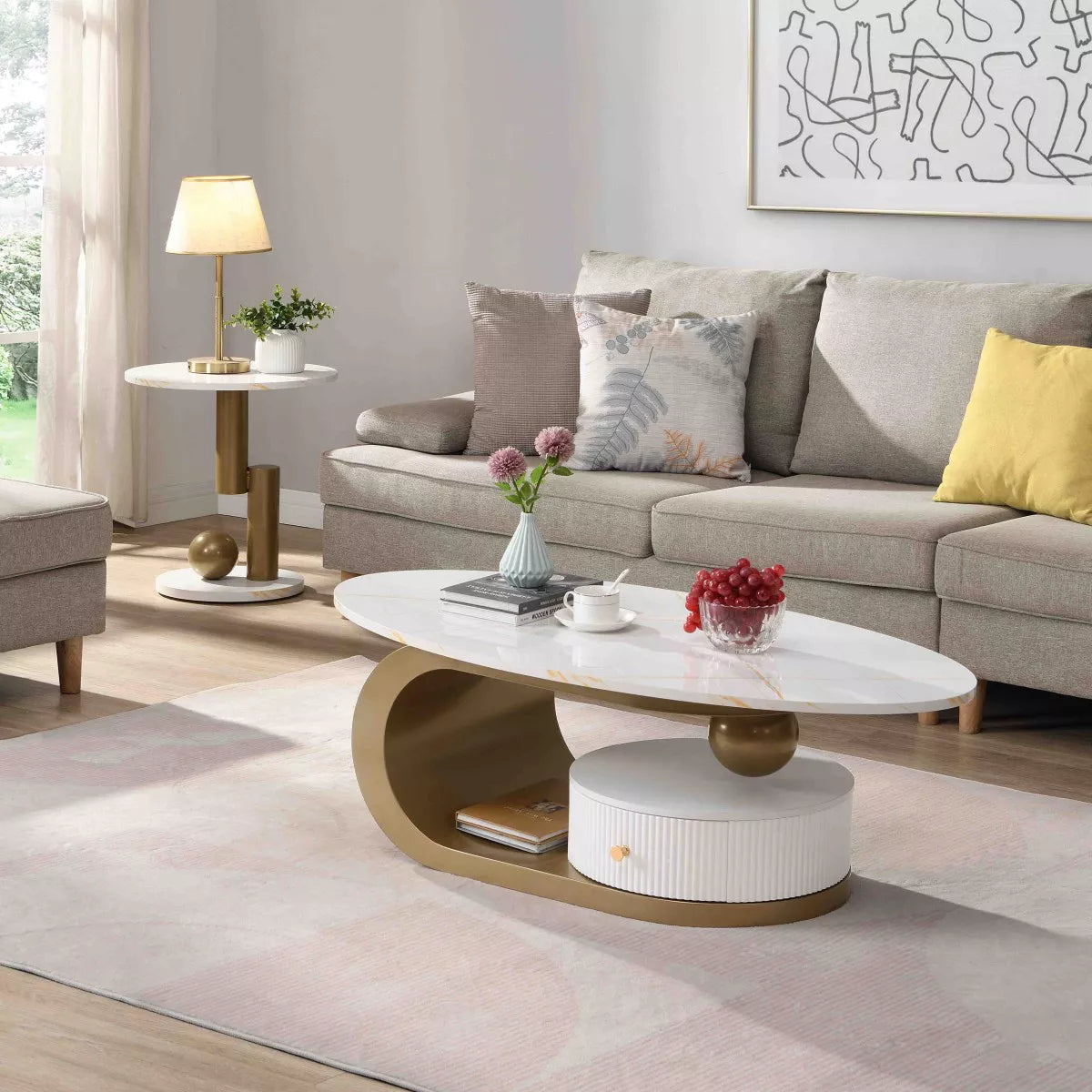 Modern side table with white top and gold cylindrical legs on a white background gold