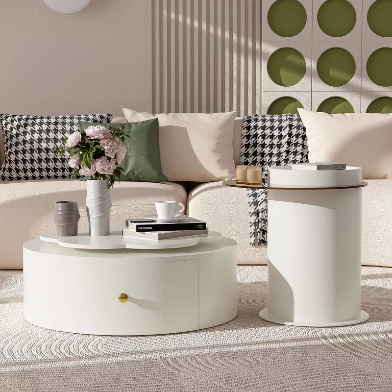 Round coffee table with decorative items in a living room setting