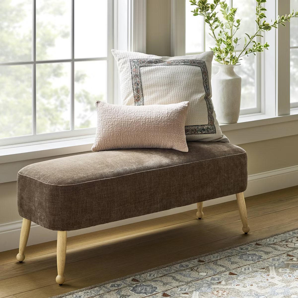 Brown upholstered bench with wooden legs on a white background Browm