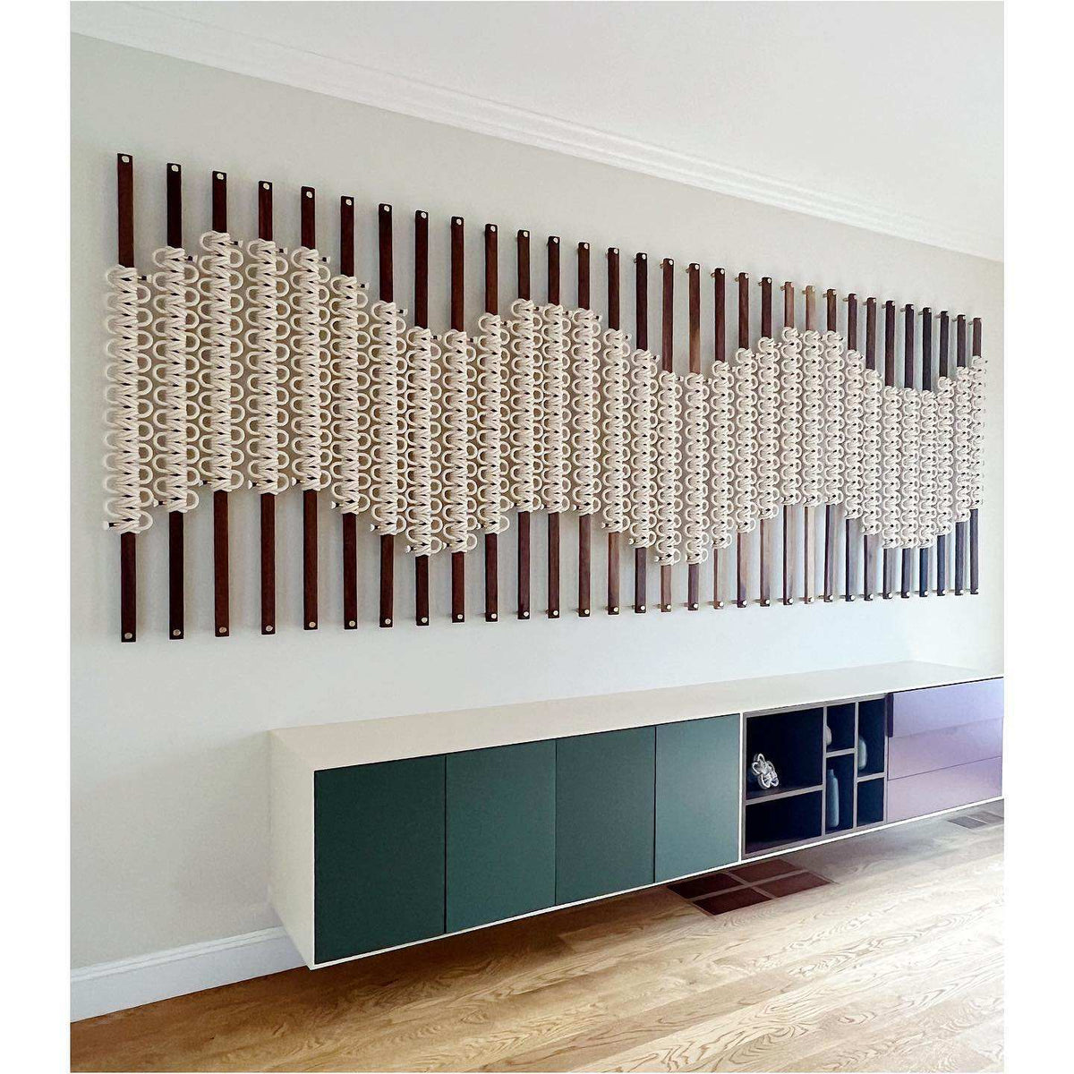 Modern radiator design on a wall with a console table below