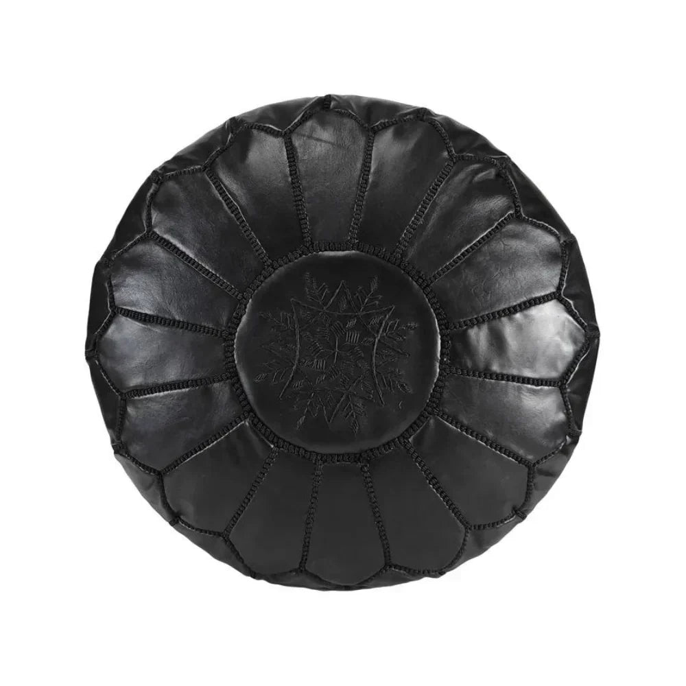 Black leather pouf on a white background