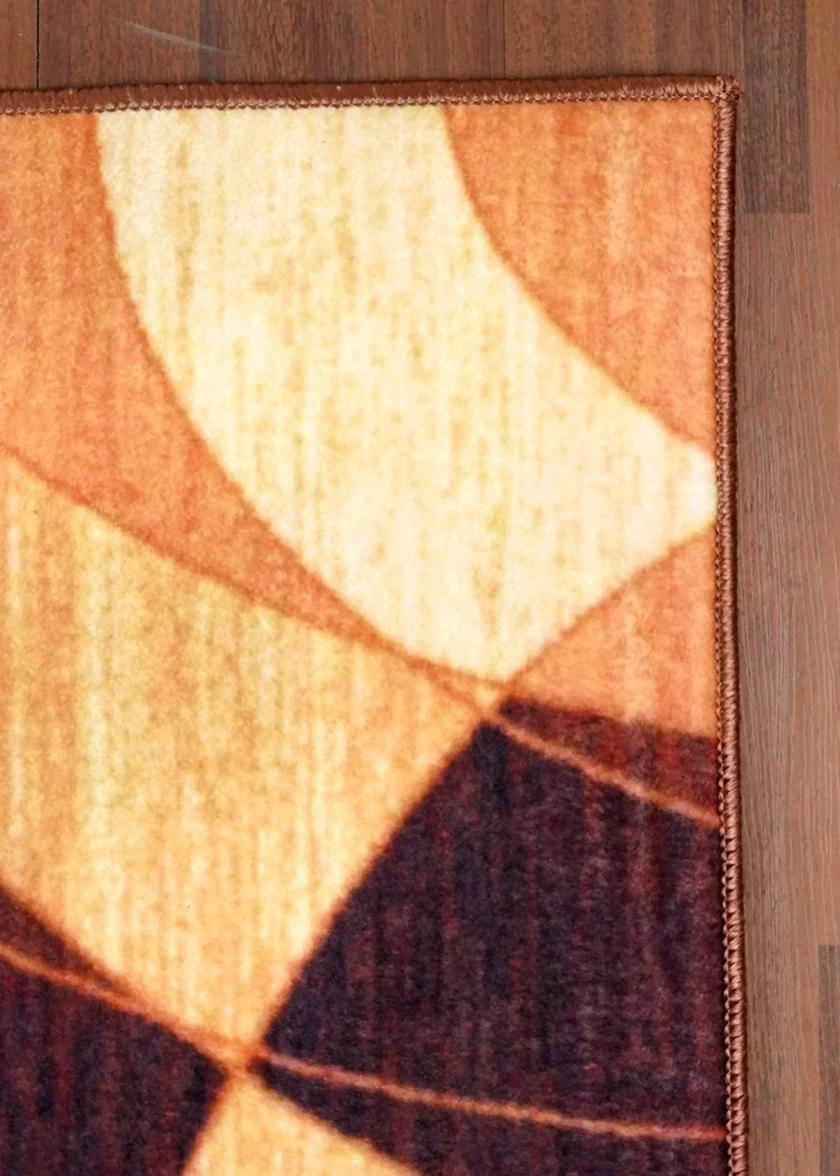 Geometric patterned rug on a wooden floor