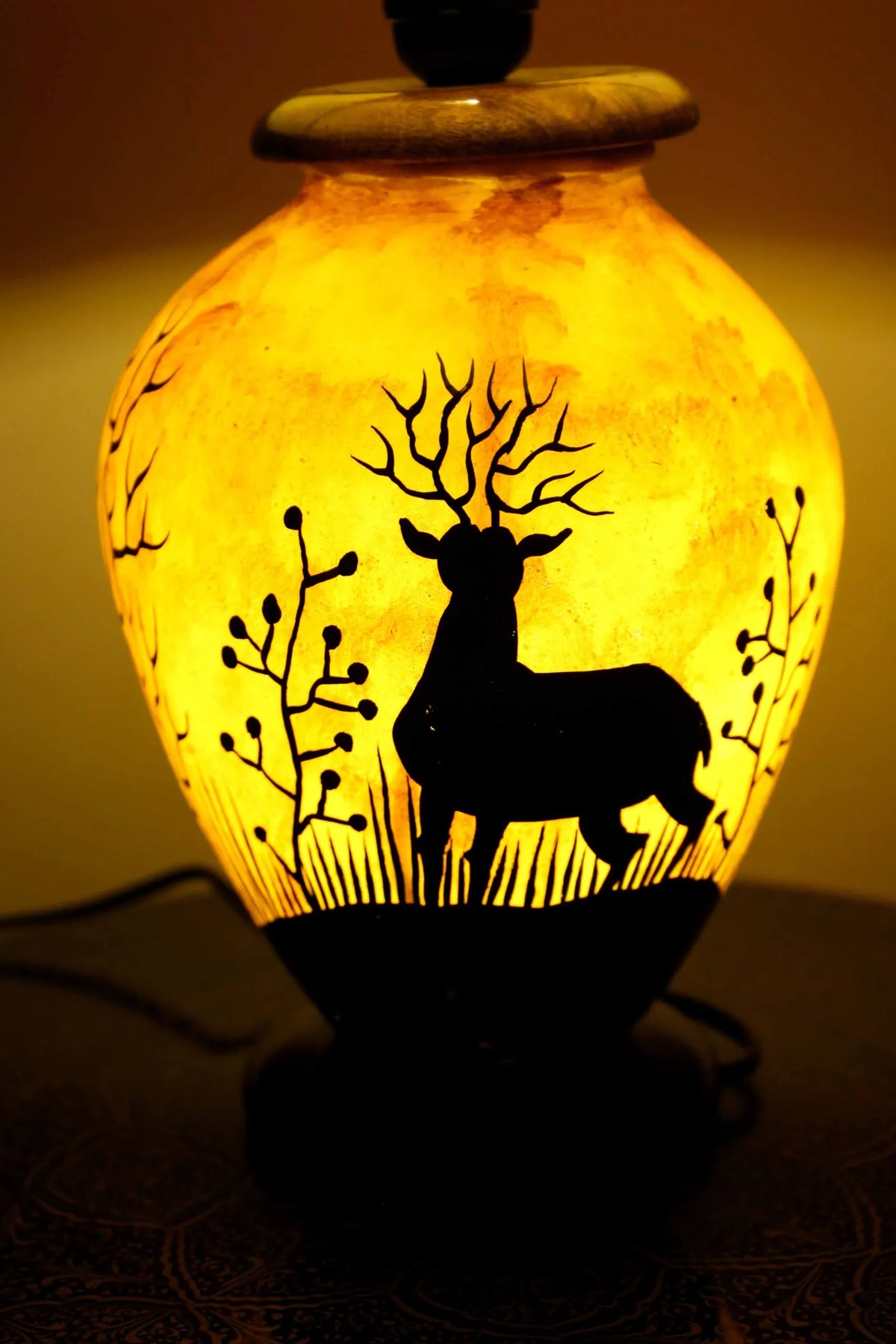 “Handpainted fluorescent camel skin lamp with wooden base – artisan-crafted decorative lamp with warm glow”