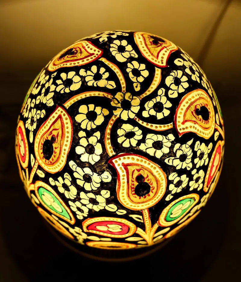 “Handcrafted fluorescent camel skin lamp with colorful patterns and pine wood base – ambient glow decor”