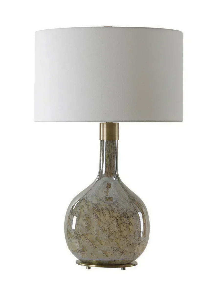 Sahara Breeze table lamp with brown seeded glass base, antique brass accents, and white linen shade.