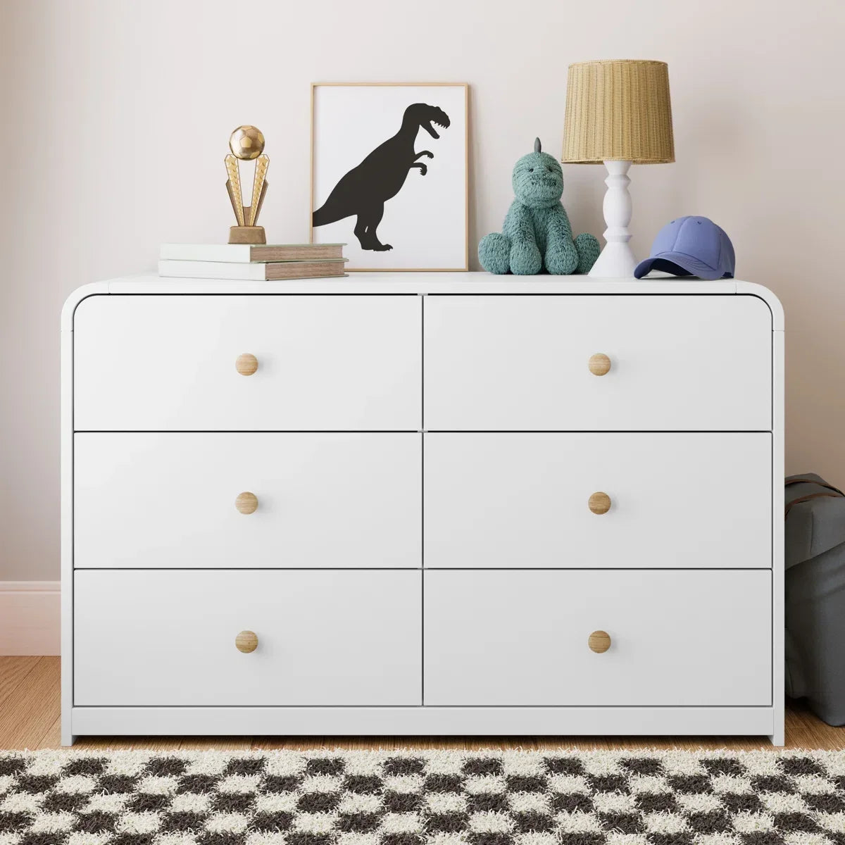 A modern 6-drawer dresser in white with small round gold knobs, shown against a clean white background.