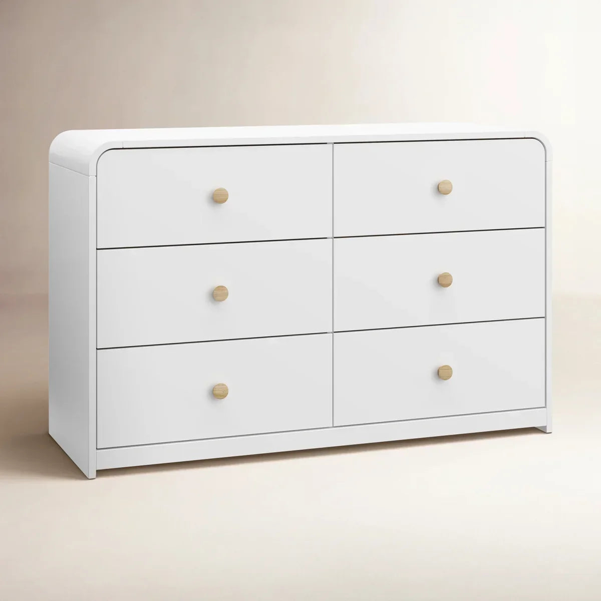 A modern 6-drawer dresser in white with small round gold knobs, shown against a clean white background.