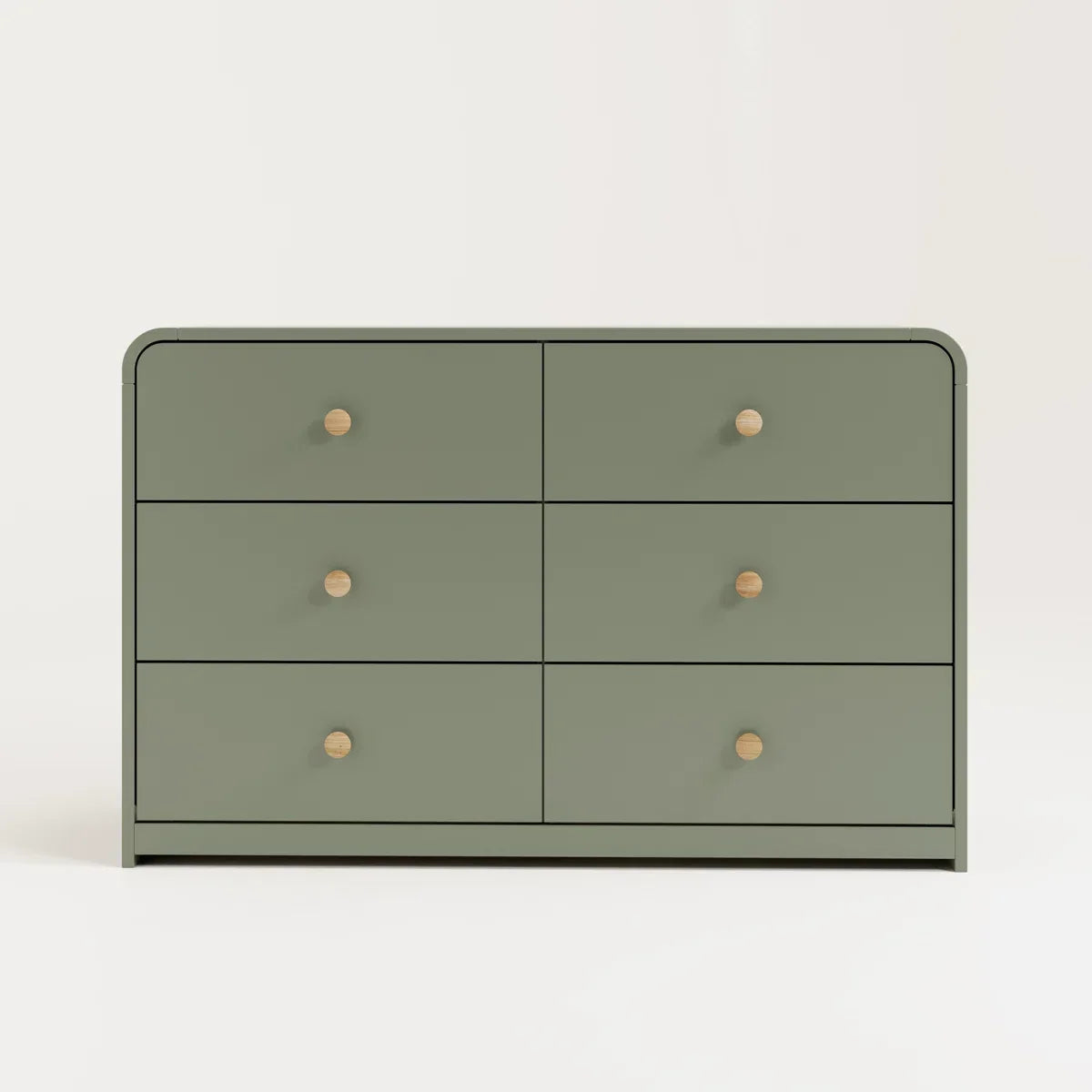 A modern six-drawer dresser in a muted sage green with small round light wood knobs, shown against a neutral beige background.