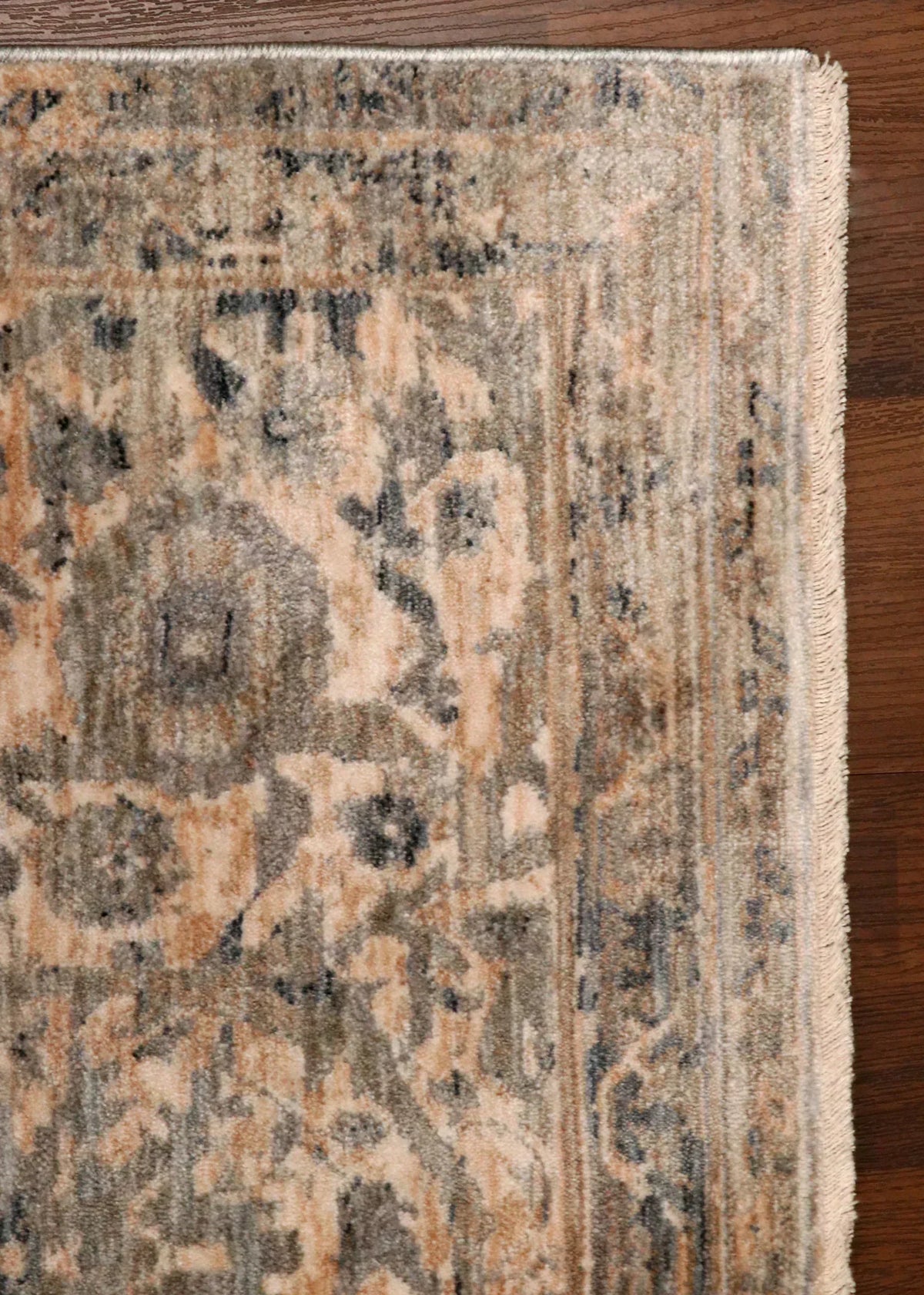 Patterned rug on a wooden floor