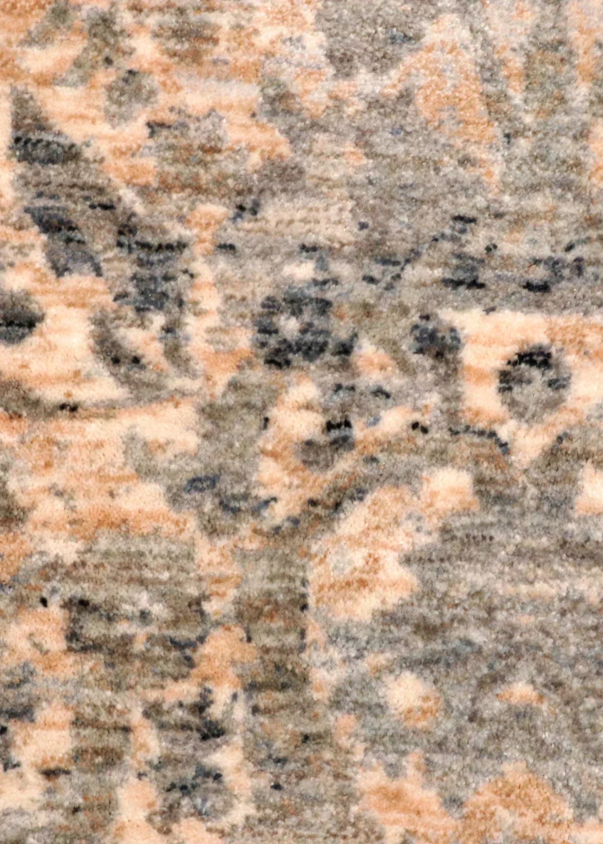 Patterned rug on a wooden floor