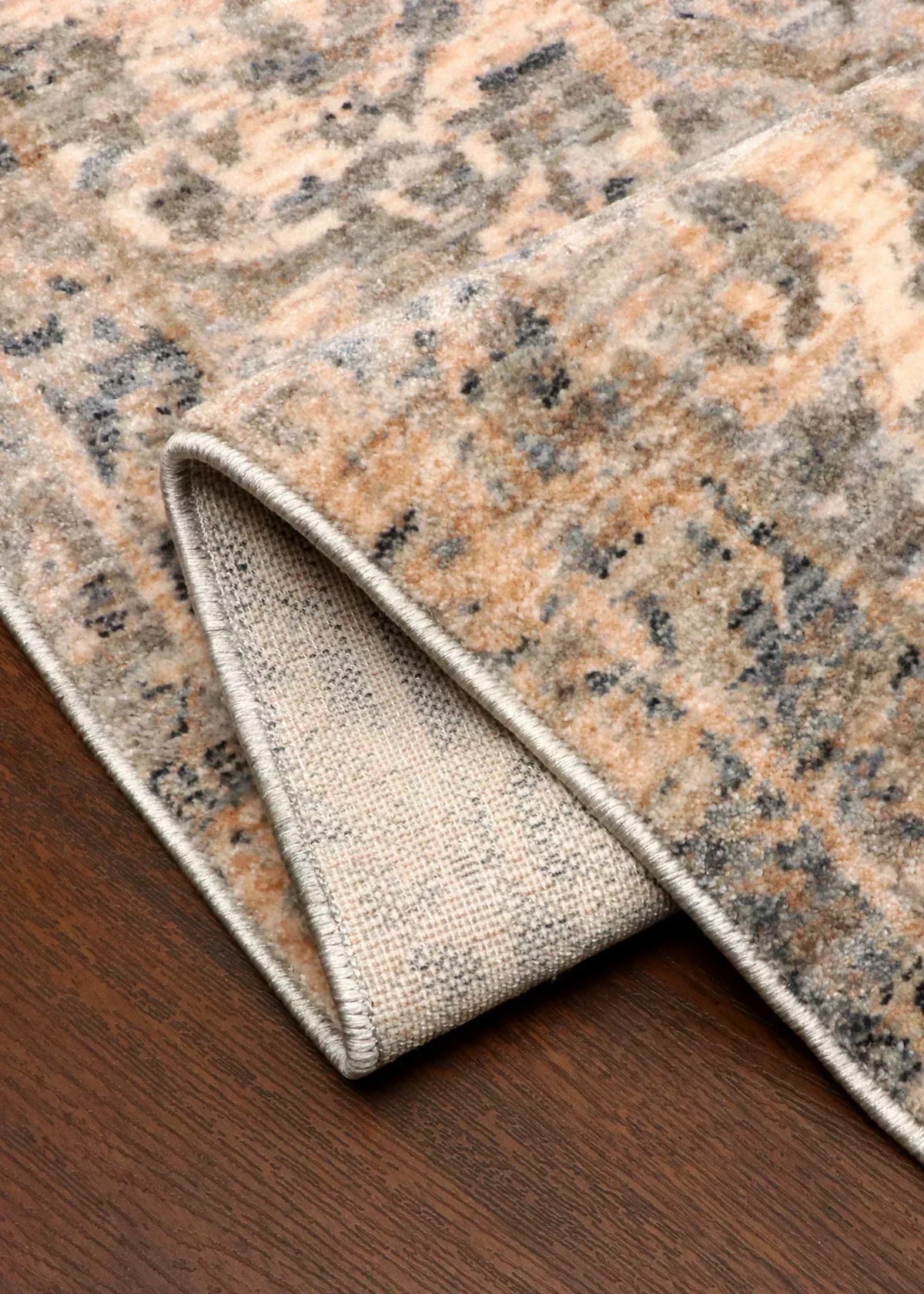 Patterned rug on a wooden floor