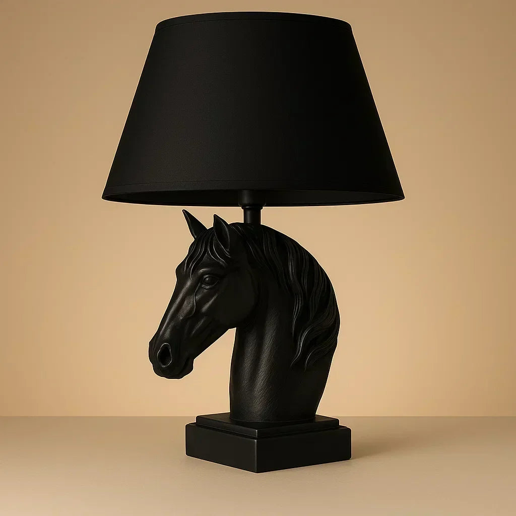 Horse head lamp on a side table next to a sofa with pillows in a warm, dimly lit room Black