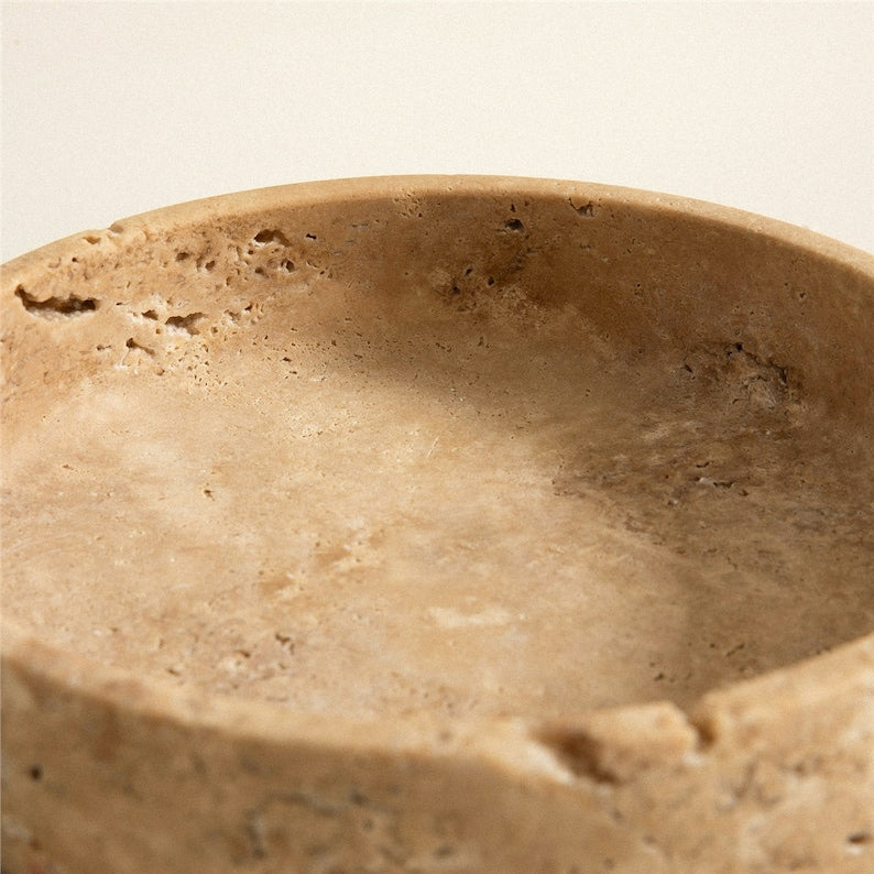 Beige ceramic bowl on a beige background