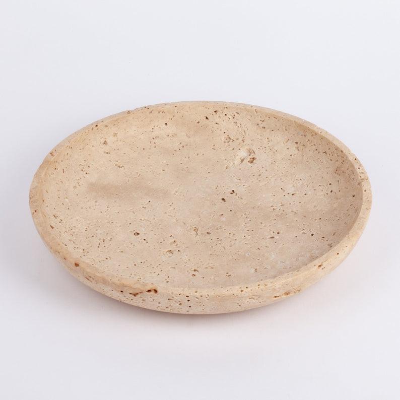 Beige ceramic plate on a white background