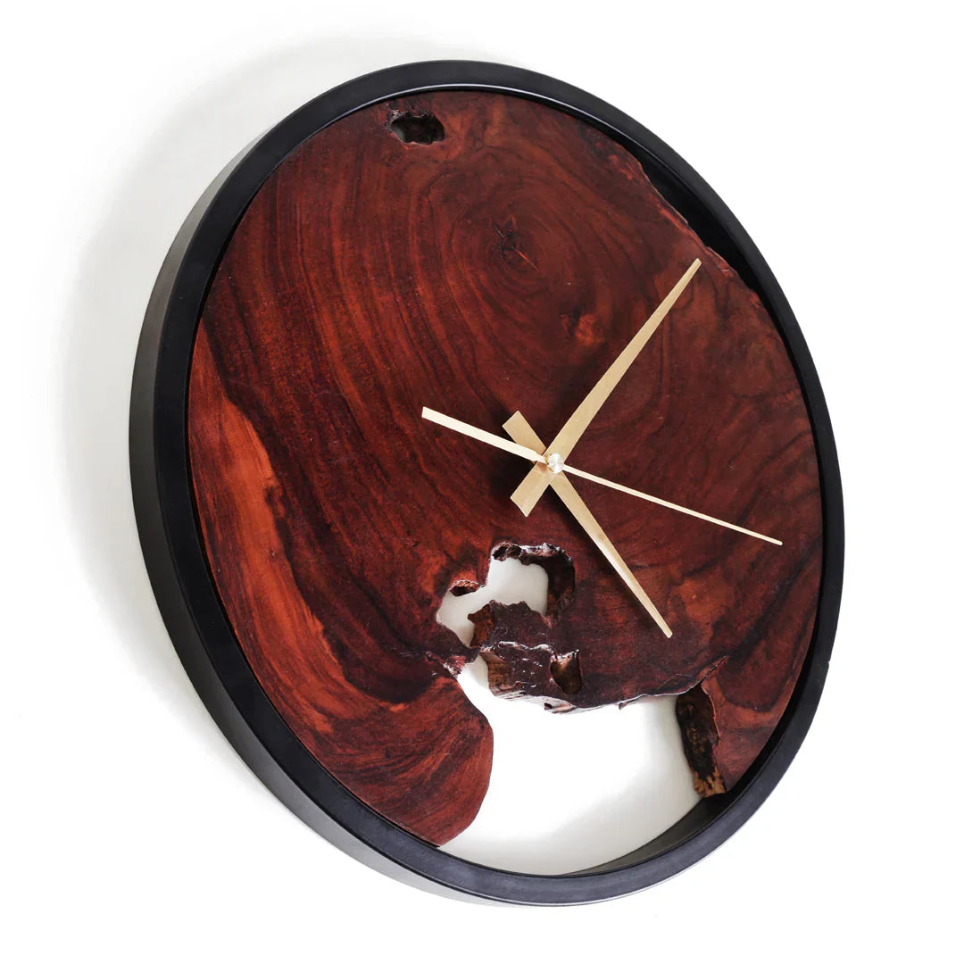 Wooden wall clock with a natural grain pattern on a white background