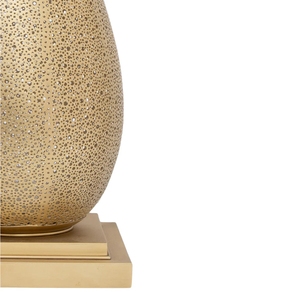 Decorative lamp with textured surface and base on a white background