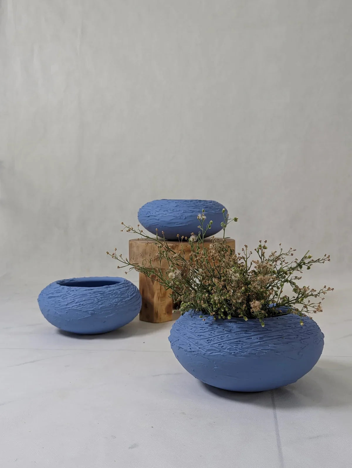 Handmade Den Soft Blue Ceramic Vase, 4" tall, 9" wide, nest-like design for home decor