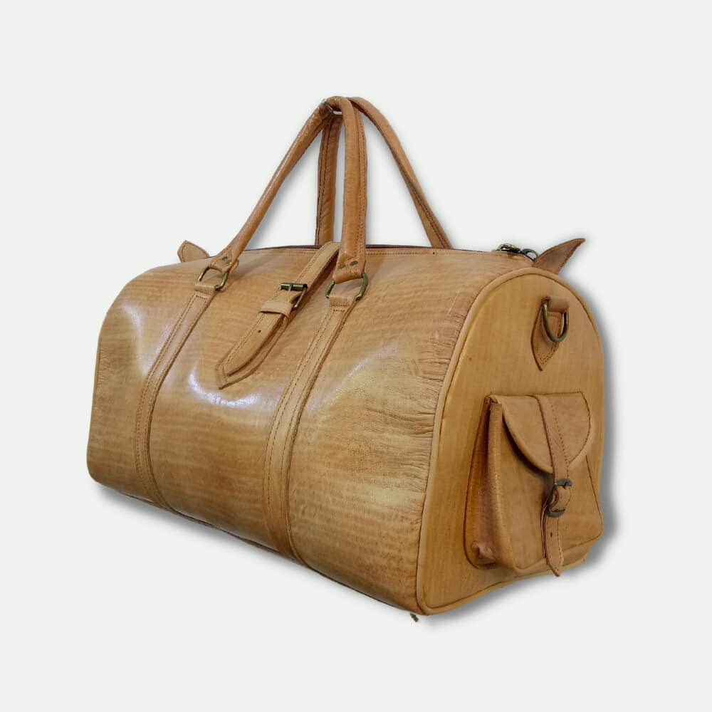 Brown leather duffel bag on a light gray background
