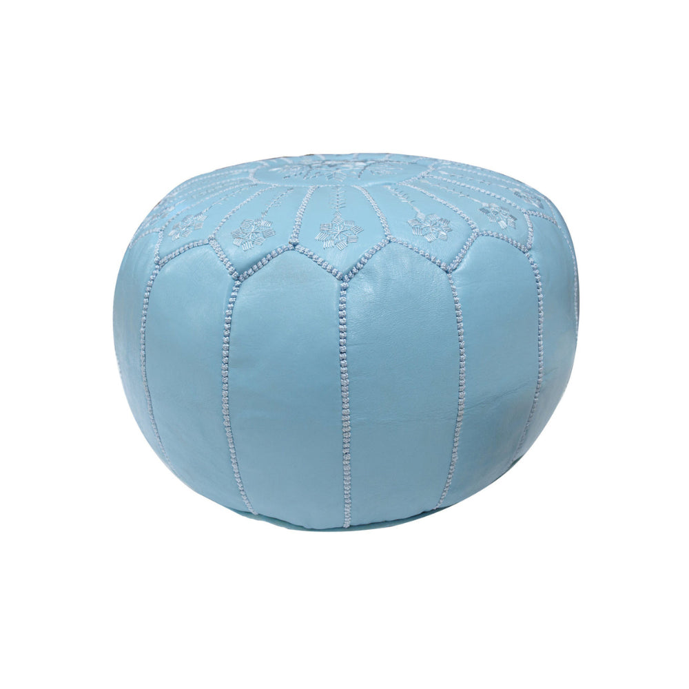 Blue ottoman with embroidered patterns on a white background
