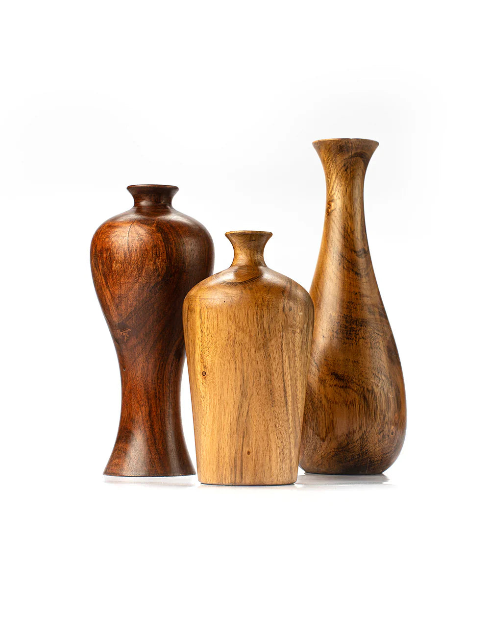 Three wooden vases of different shapes and sizes on a white background