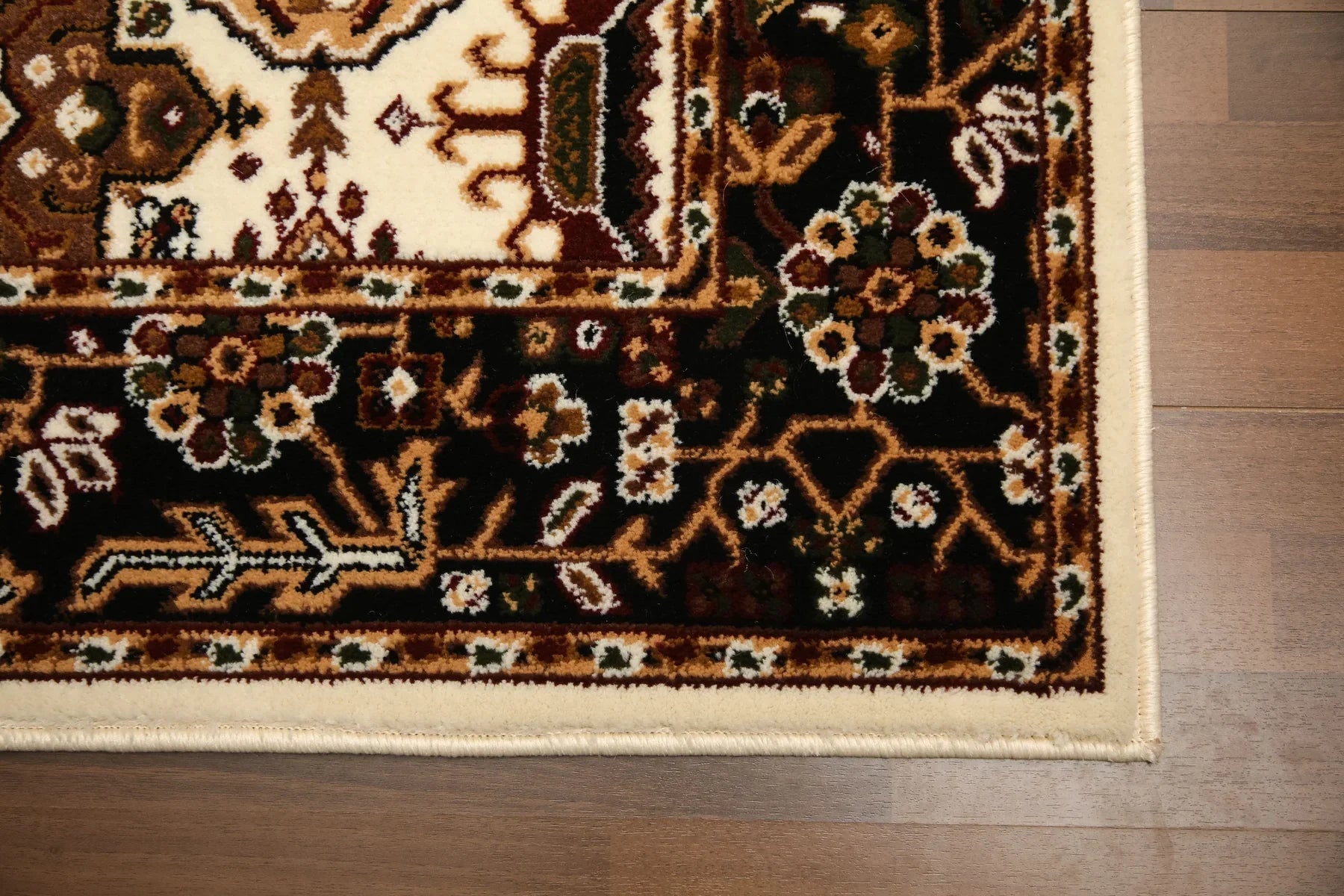 Decorative rug with intricate patterns on a wooden floor