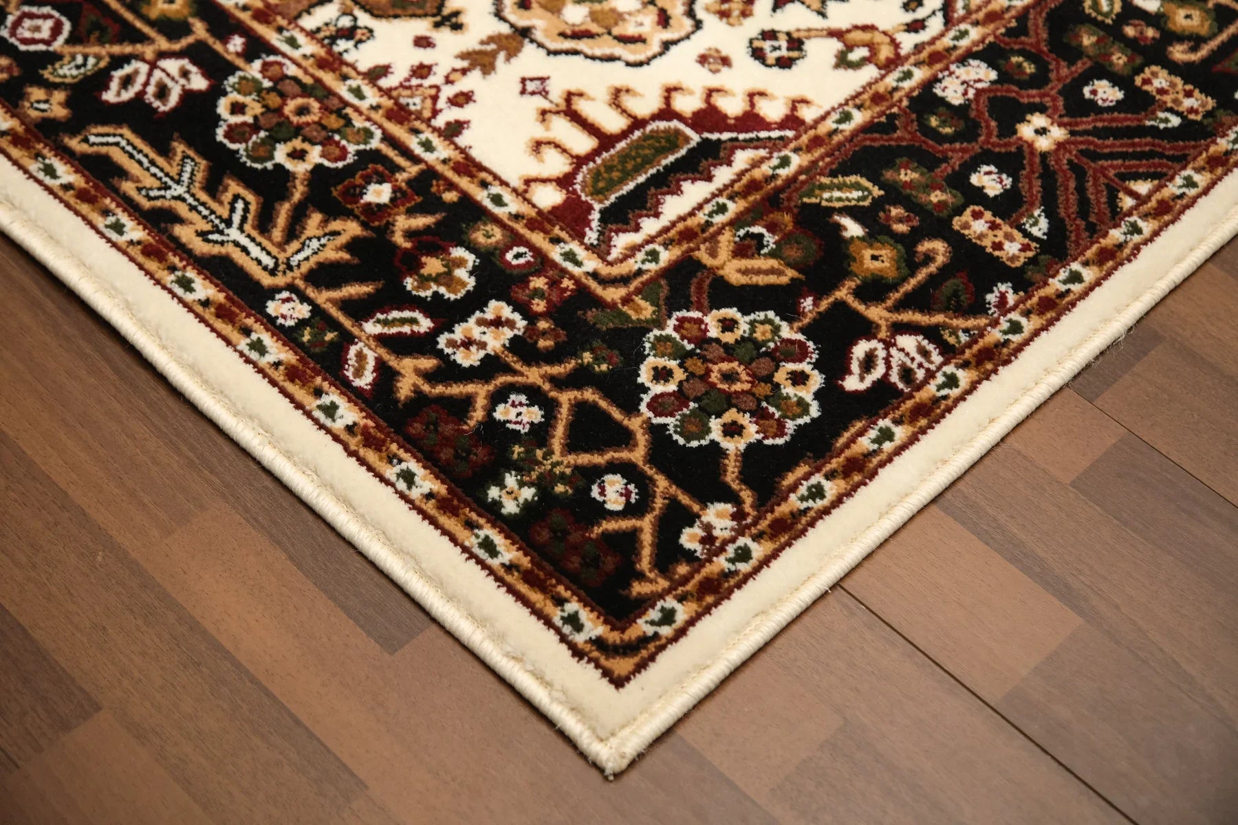 Decorative rug with intricate patterns on a wooden floor