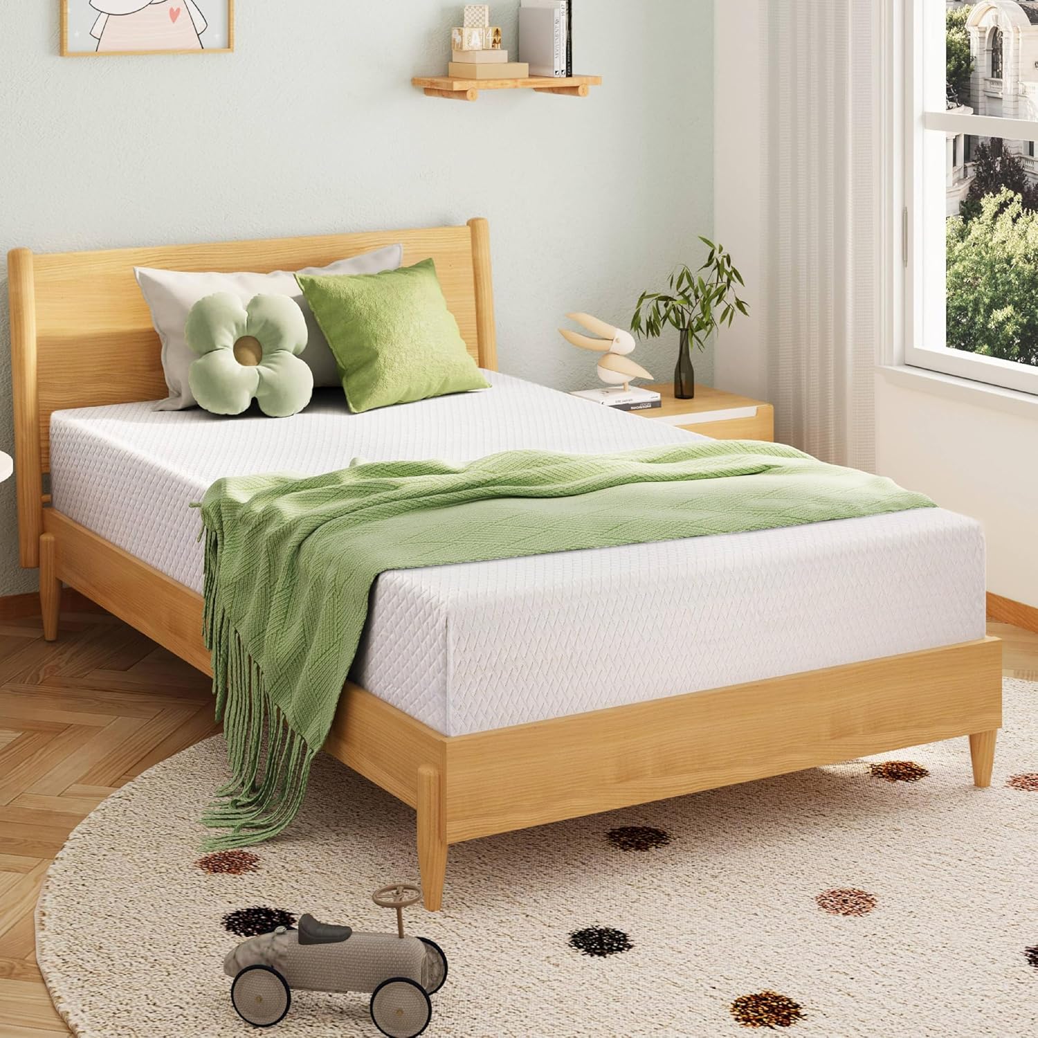 Bedroom with a wooden bed, green bedding, and decorative elements.