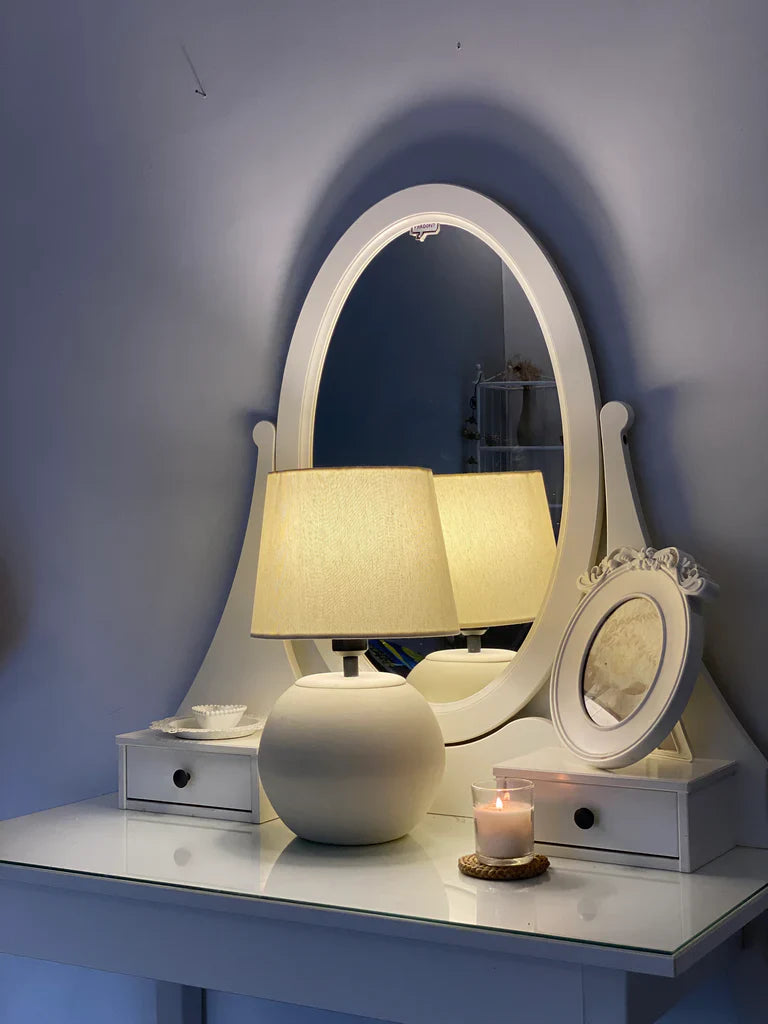 “MELLOW’ lamp with matte-finished terracotta base and black accents, paired with a cream shade – 18-inch handcrafted ceramic lighting.”