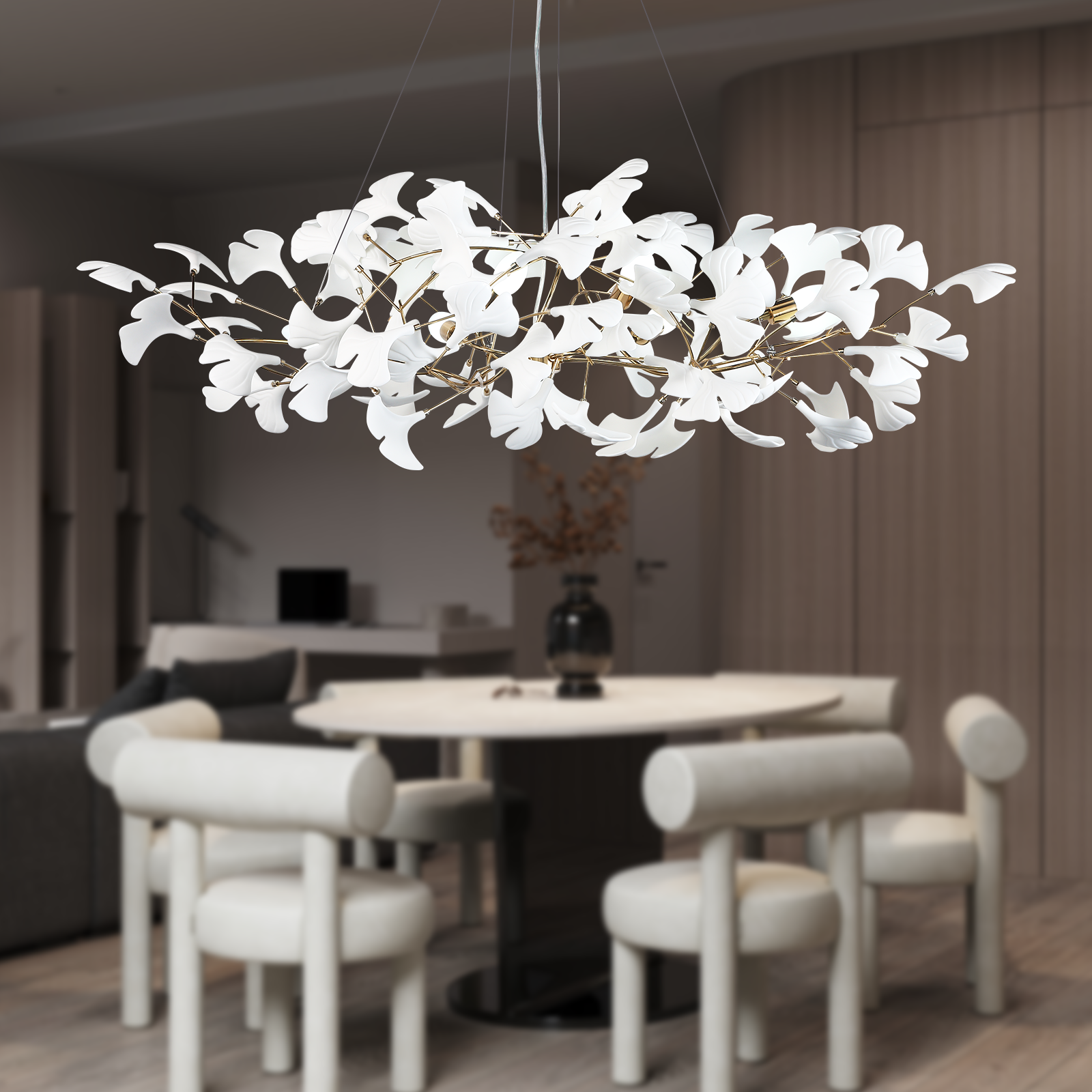 Modern chandelier hanging above a dining table in a stylish room.