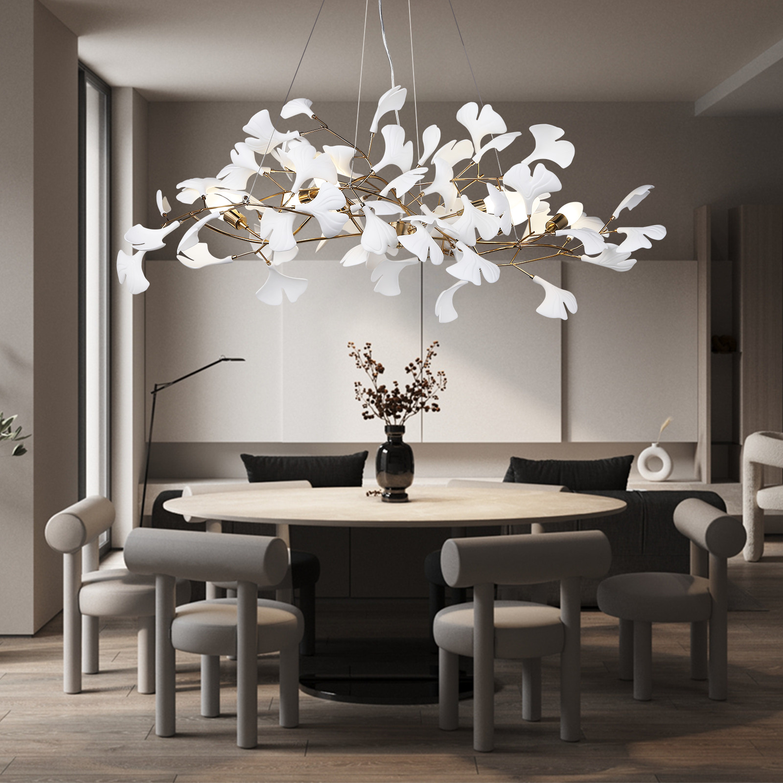 Modern dining room with a round table and chairs, featuring a decorative chandelier.