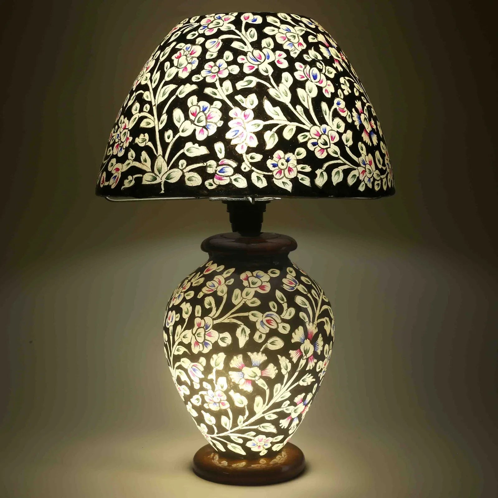 “Unique handpainted camel skin lamp with intricate artisan patterns and warm glow on pine wood base – traditional handmade decor”